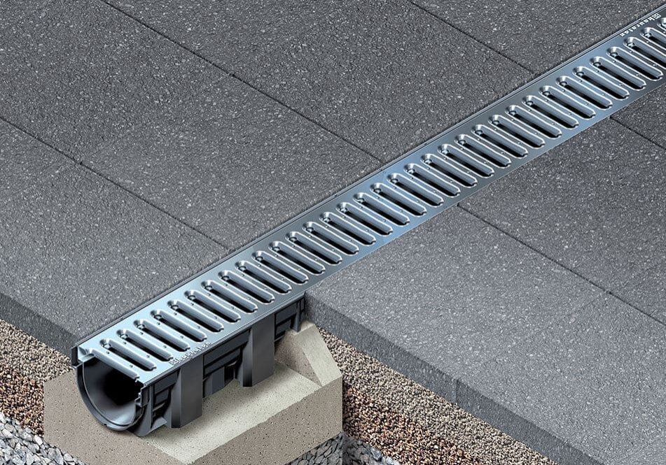 Surface drain installed in paving stones.