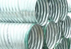 A stack of metal pipes with green lines.